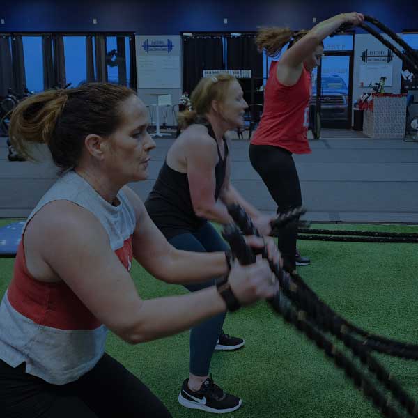 Full30Fit members working through a battle-rope class.